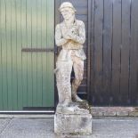 An antique life size cast stone figure of a poacher