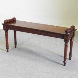 A hand made mahogany window seat