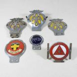 A collection of vintage AA and other car badges