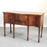 A Regency style mahogany serpentine sideboard