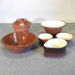 A collection of large dairy pottery items