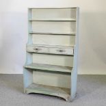 A green painted waterfall bookcase