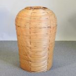 A large mid century cane basket