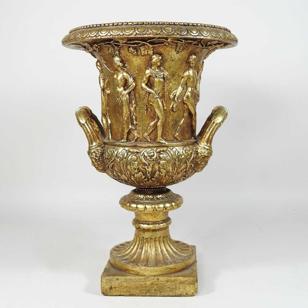 A gilt decorated Grecian style vase