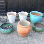 A pair of pale glazed garden pots