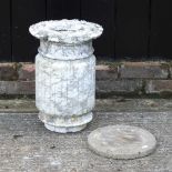 A weatherd marble garden pedestal