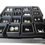 A collection of pairs of earrings