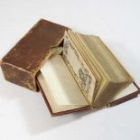 A miniature volume of La Divina Comedia di Dante