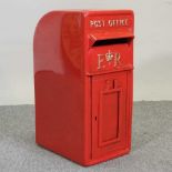 A red metal post box