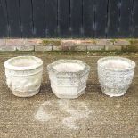 Three cast stone garden pots