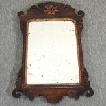 A George III walnut and parcel gilt wall mirror