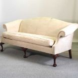 A George III style beige upholstered hump back sofa