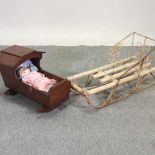 A wooden cradle and sledge