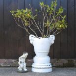 A white ceramic garden pot on stand