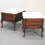 A pair of marble top bedside tables