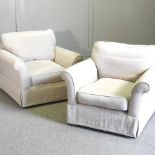 A pair of white linen upholstered armchairs