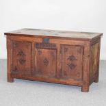 A 20th century carved oak coffer