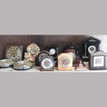 A collection of various mantel clocks