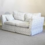 A modern blue and white upholstered sofa