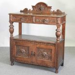 A Victorian carved oak buffet