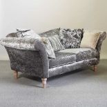 A grey crushed velvet upholstered sofa