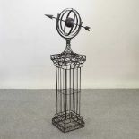 A black painted metal garden armillary