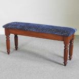 A Regency style blue upholstered window seat