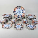 A suite of Imari pattern porcelain table wares