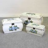 A set of three white painted wooden graduated boxes