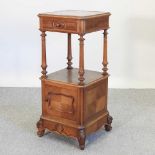 A 19th century French walnut bedside cabinet