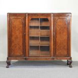 A 1920's walnut dwarf bookcase