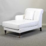 A modern white leather upholstered chaise longue