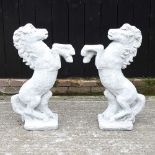 A pair of reconstituted stone horses
