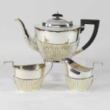 A modern silver three piece tea service