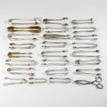 A collection of twenty five 19th century silver plated sugar tongs