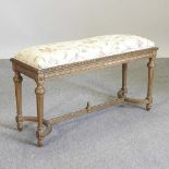 A carved and gilt painted window seat