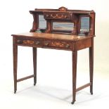 An Edwardian rosewood and inlaid writing table