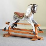 A 20th century grey painted wooden rocking horse