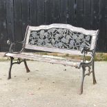 A green painted metal and wooden garden bench