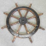 A vintage wooden ship's wheel