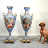 A pair of large and impressive Sevres style porcelain vases