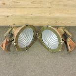 A pair of copper and brass ship's bulkhead lights