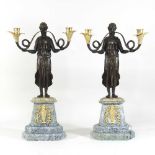 A pair of Empire style bronze candelabra