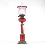 A 19th century Irish ruby glass oil lamp