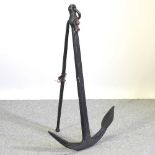 A black painted iron ship's anchor