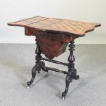 A Victorian walnut games/work table