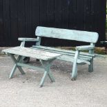 A green painted garden bench