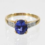 An 18 carat gold sapphire and diamond ring