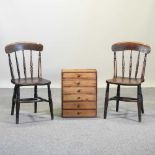 A pair of elm seated spindle back chairs