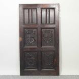 An early 20th century continental carved oak door